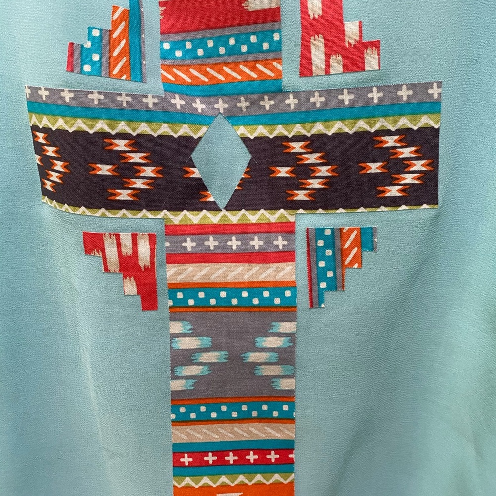 Sheer lined southwestern tank top.